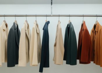 ai generated, coats, clothing, jacket collection, clothing rack, hanging, rack, coat hanging, jackets, wardrobe setup, stylish apparel, fashion, wardrobe, display, apparel, outerwear, closet, style, fashion display